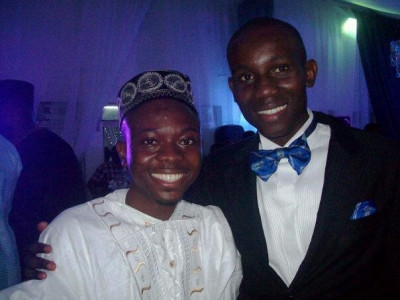 Adebayo (left), aged 21, with his friend Peter at the Centenary celebration of alma mater- King’s College Lagos 